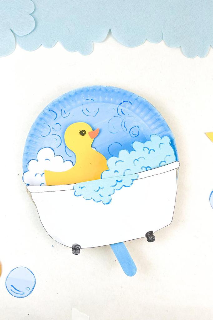 duck puppet in paper plate bath